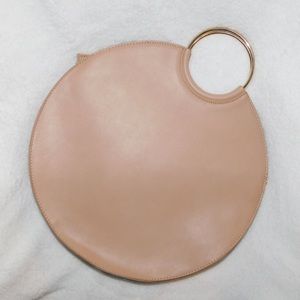Circle tan/cream handbag with brass ring handles